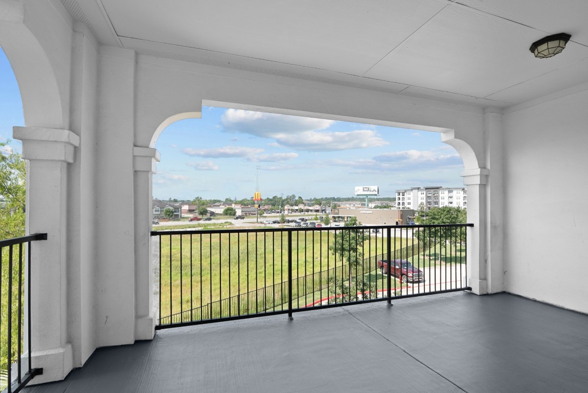 366 Fm 1488 Road, Unit 937 Conroe, TX 77384 - Photo 20 of 24 a view of a balcony with city view