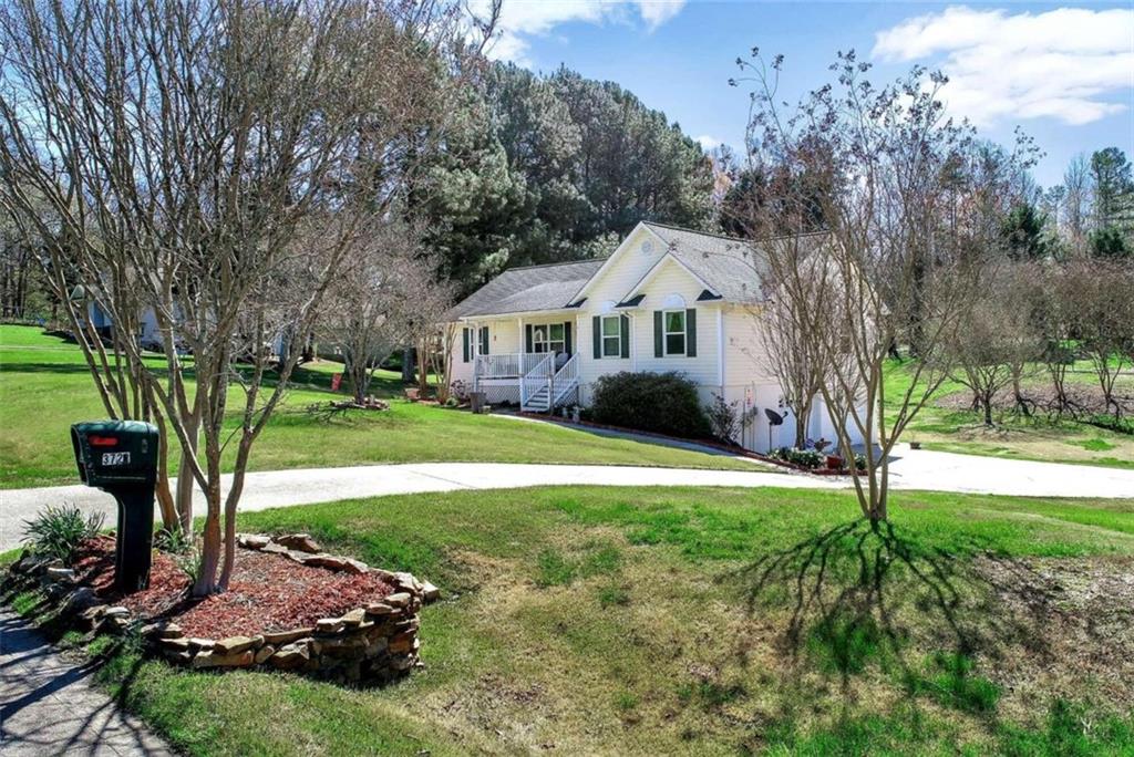 a front view of a house with a yard table and chairs