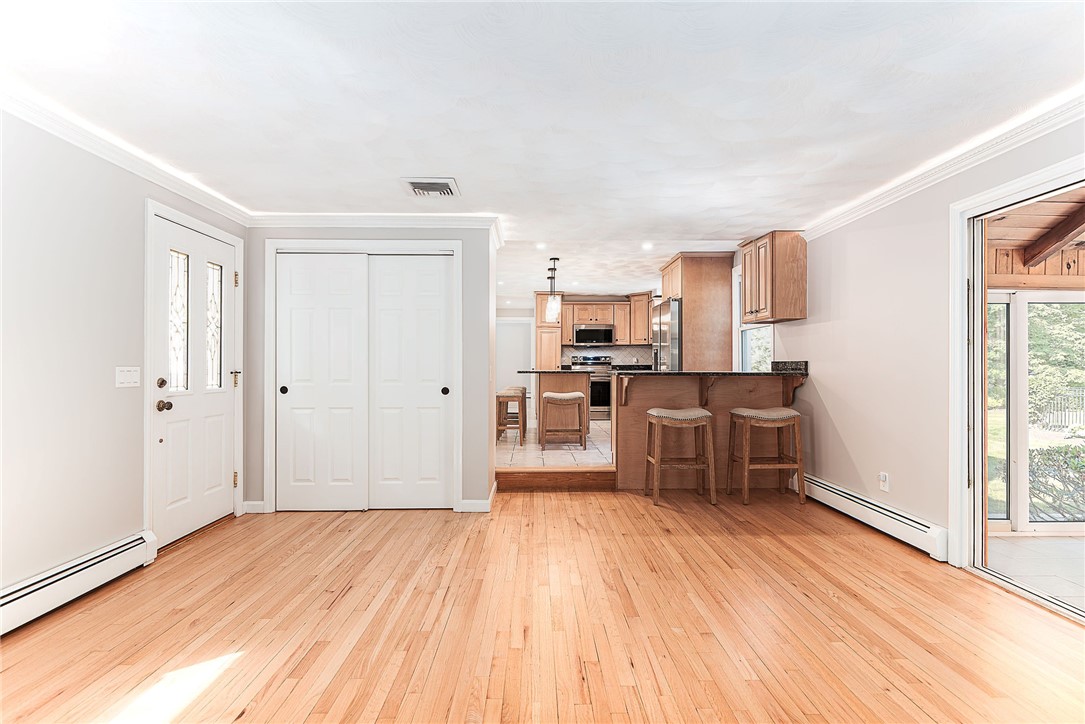 680 Fletcher Road North Kingstown, RI 02852 - Photo 14 of 41 Great entertaining space with family room opening to kitchen and 3 season room