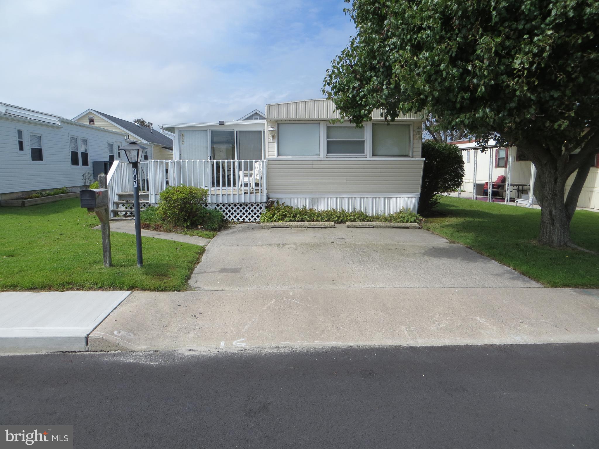 187 Clamshell Road Ocean City, MD 21842 - Photo 2 of 31 The property features a 2-car cement parking pad.