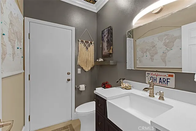 a bathroom with a sink toilet and vanity