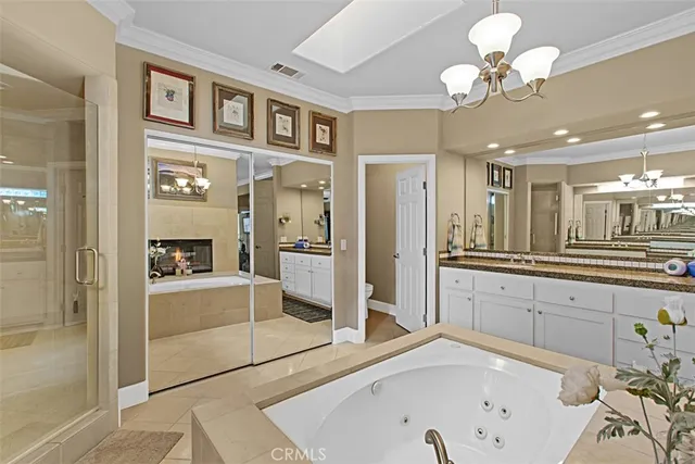 a large bathroom with a large tub and sink