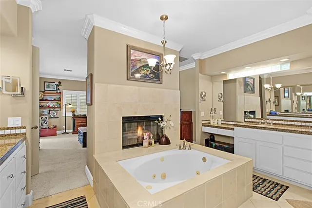 a white bath tub sitting in a bathroom and sink