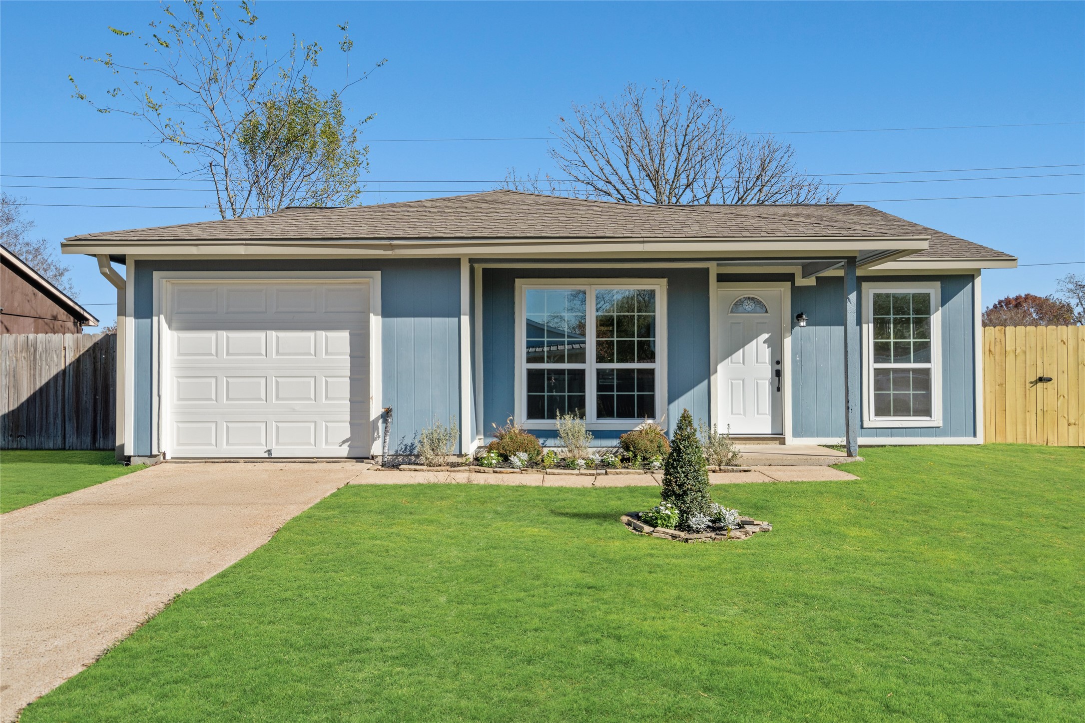 a front view of a house with garden