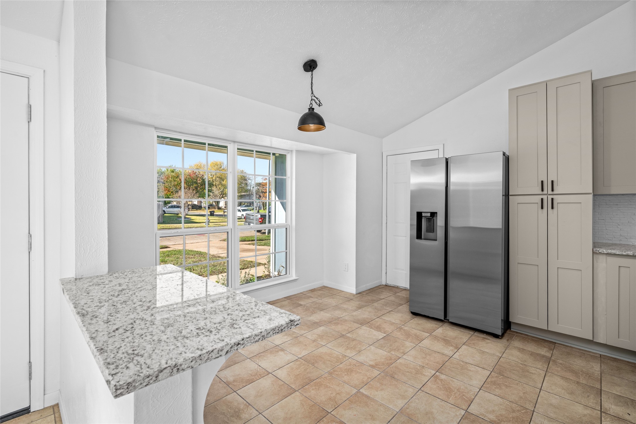 17510 Bullis Gap Drive Hockley, TX 77447 - Photo 15 of 21 a kitchen with granite countertop a refrigerator and a sink