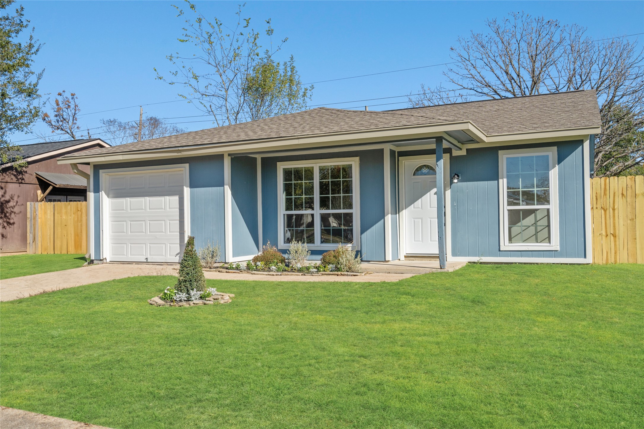 17510 Bullis Gap Drive Hockley, TX 77447 - Photo 20 of 21 a front view of a house with a garden and yard