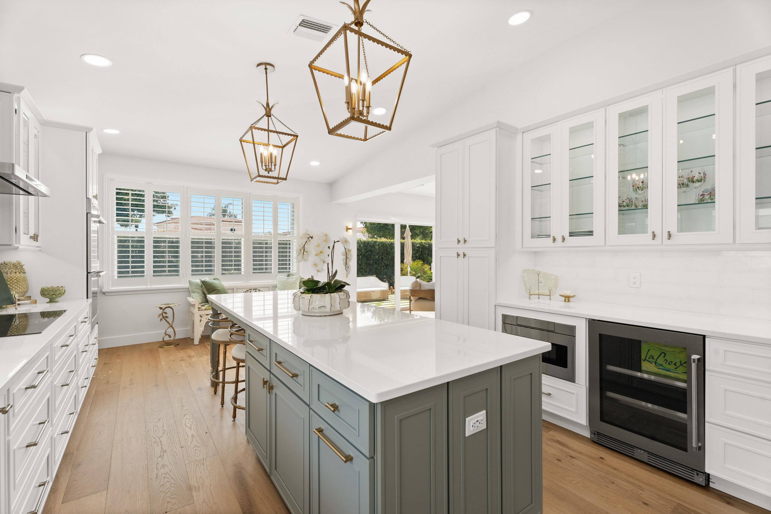 3660 Northwind Court Jupiter, FL 33477 - Photo 13 of 69 a kitchen with a stove a sink and dishwasher with wooden floor