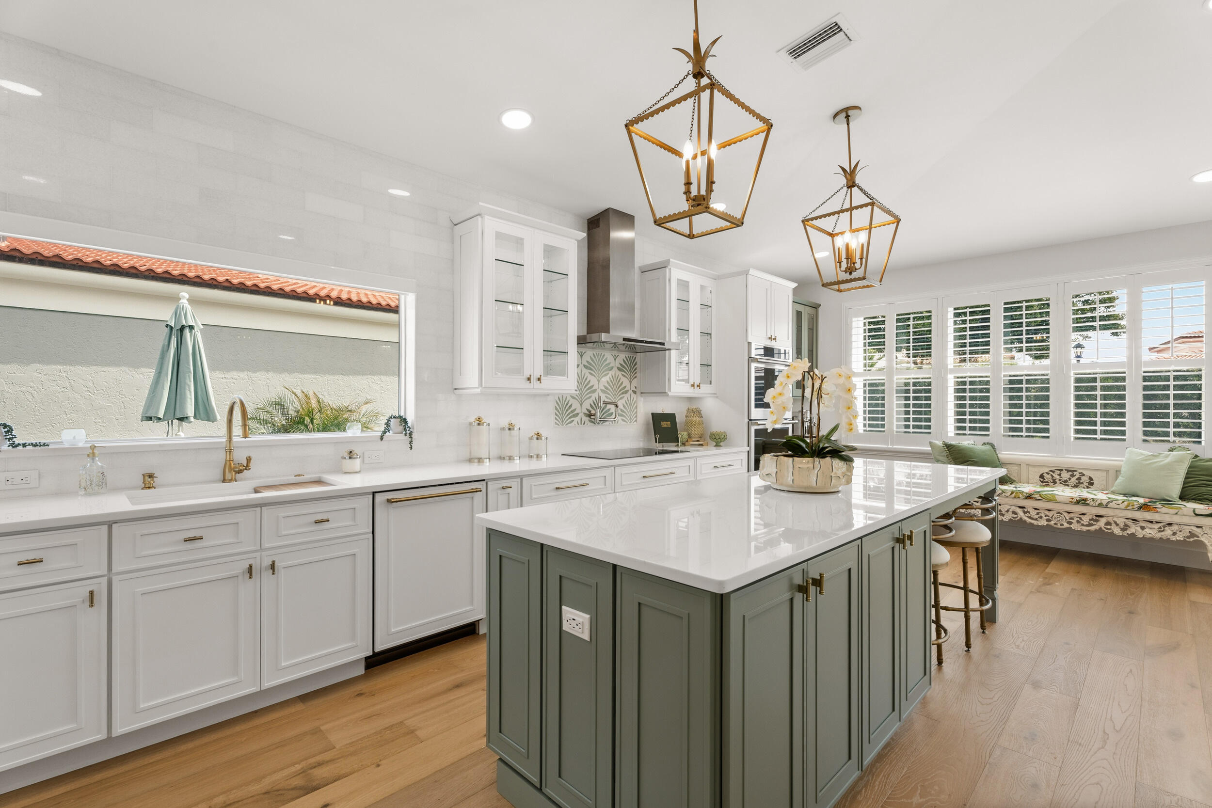 3660 Northwind Court Jupiter, FL 33477 - Photo 14 of 69 a kitchen with stainless steel appliances granite countertop a sink a stove and a wooden floors