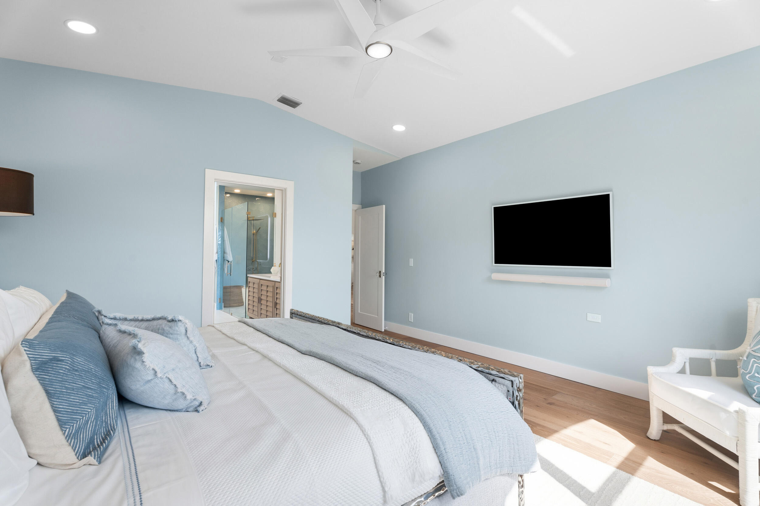 3660 Northwind Court Jupiter, FL 33477 - Photo 21 of 69 a bedroom with a bed and a flat screen tv