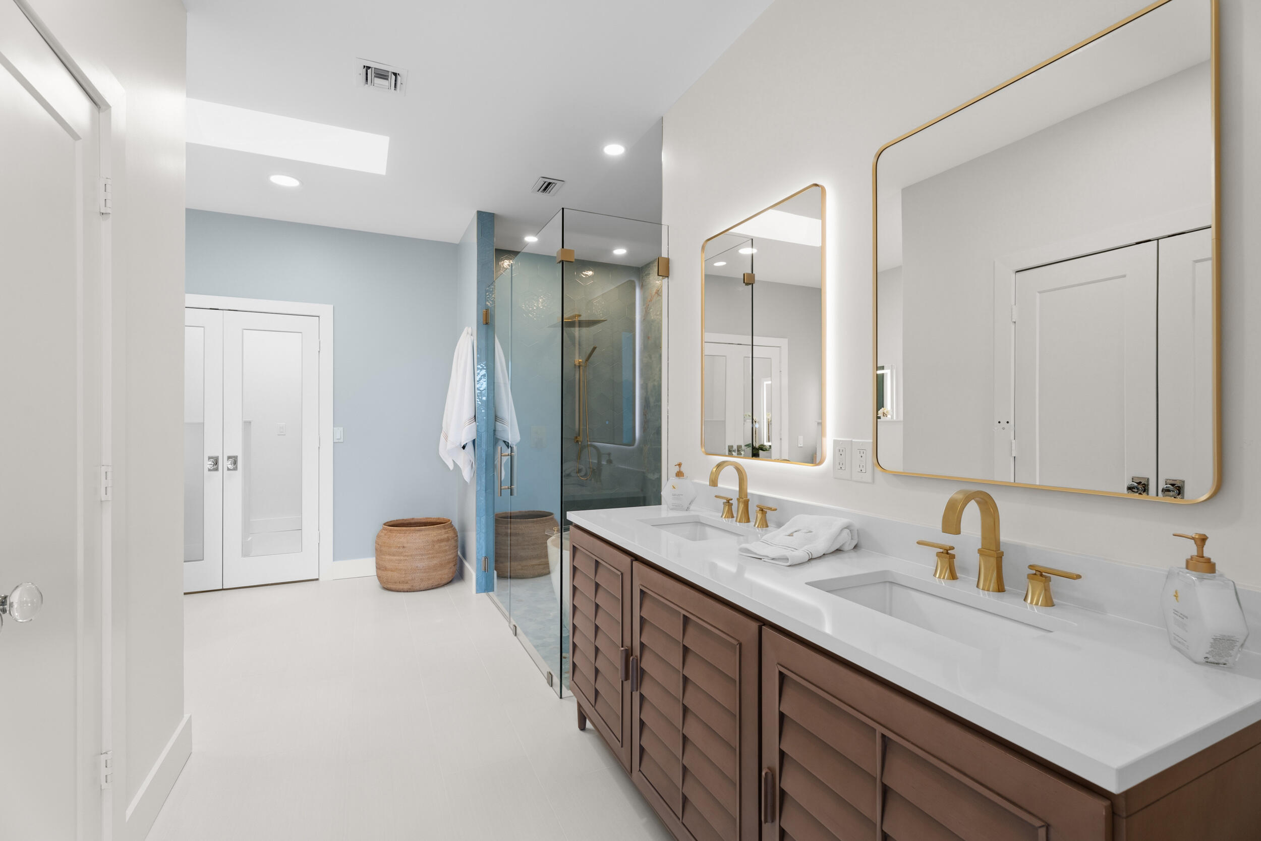 3660 Northwind Court Jupiter, FL 33477 - Photo 22 of 69 a spacious bathroom with a sink double vanity and a mirror