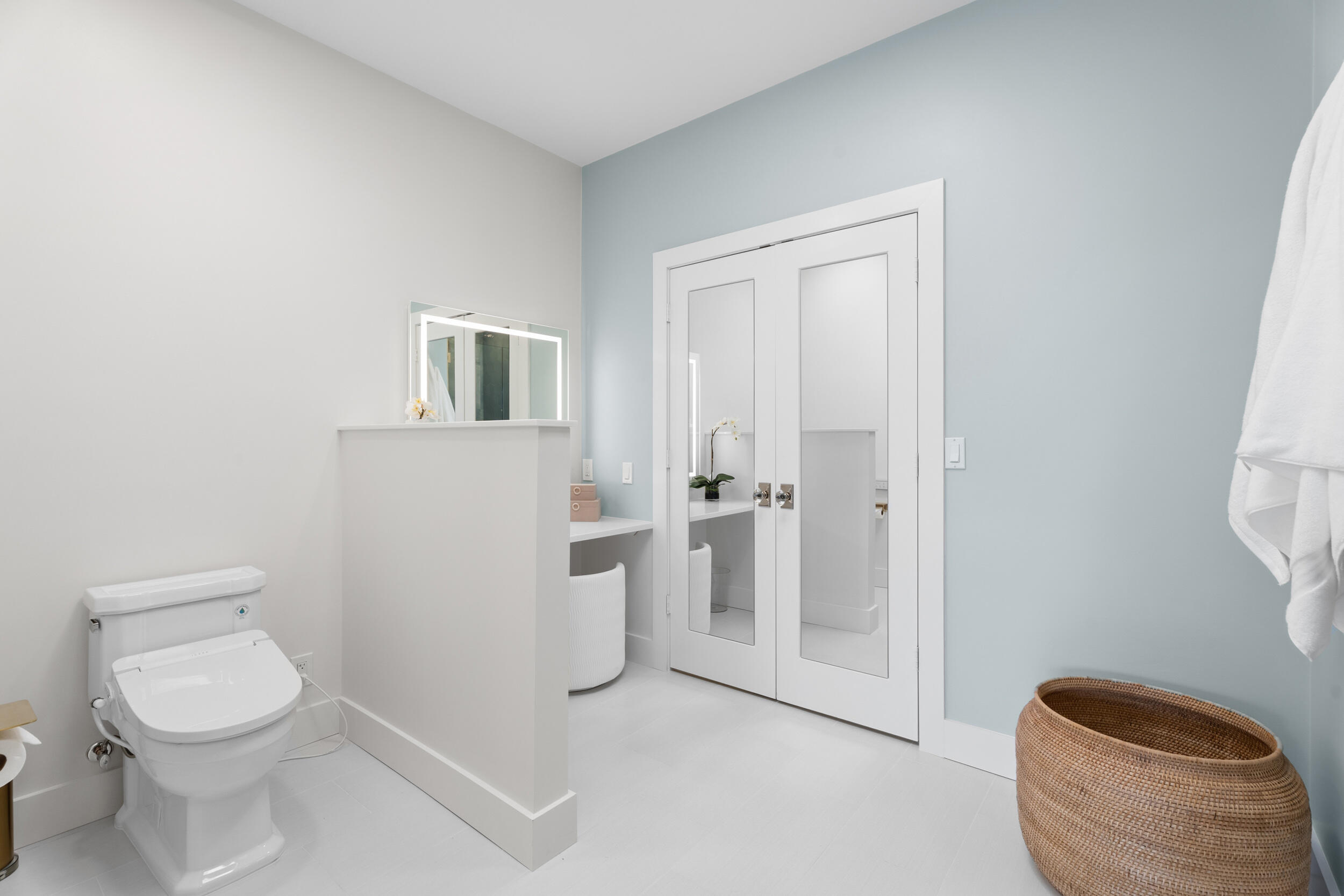 3660 Northwind Court Jupiter, FL 33477 - Photo 23 of 69 a white toilet sitting next to a bathroom sink