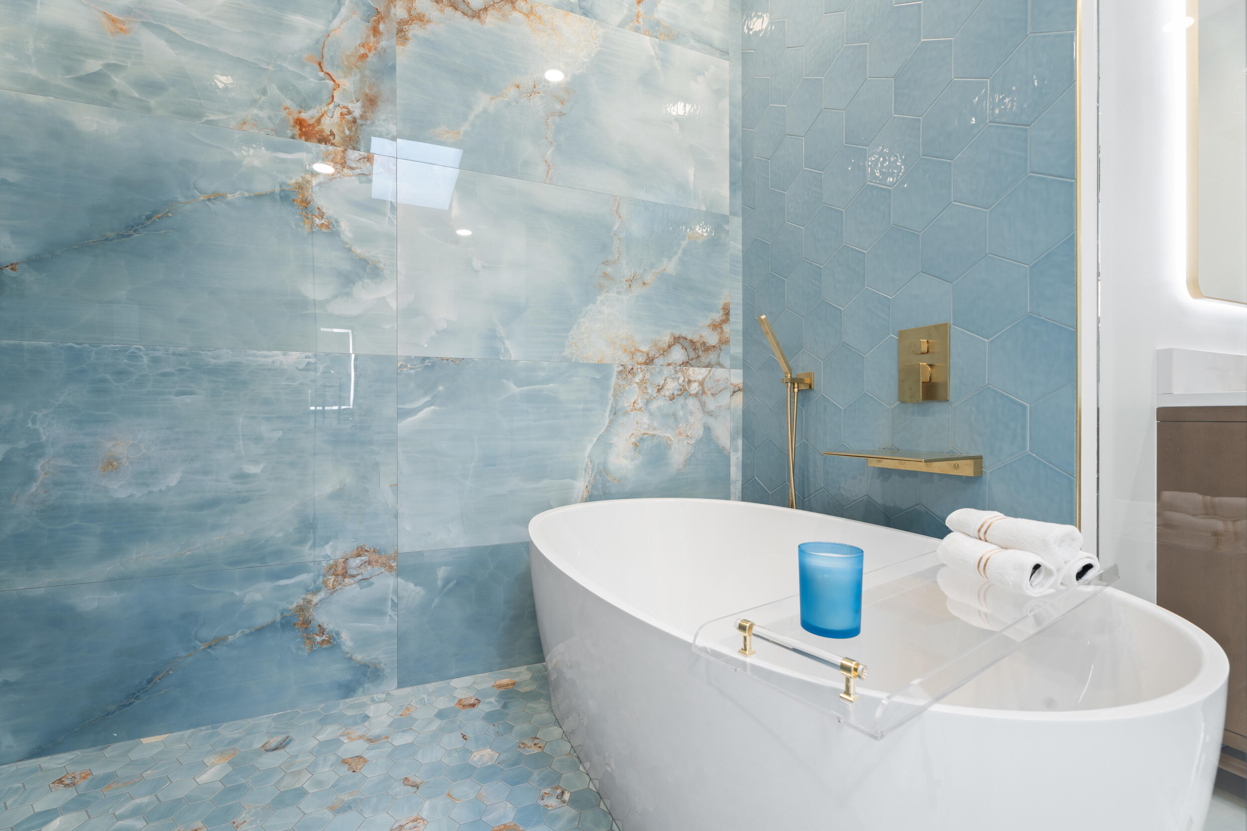 3660 Northwind Court Jupiter, FL 33477 - Photo 27 of 69 a bathroom with a sink a bathtub and shower