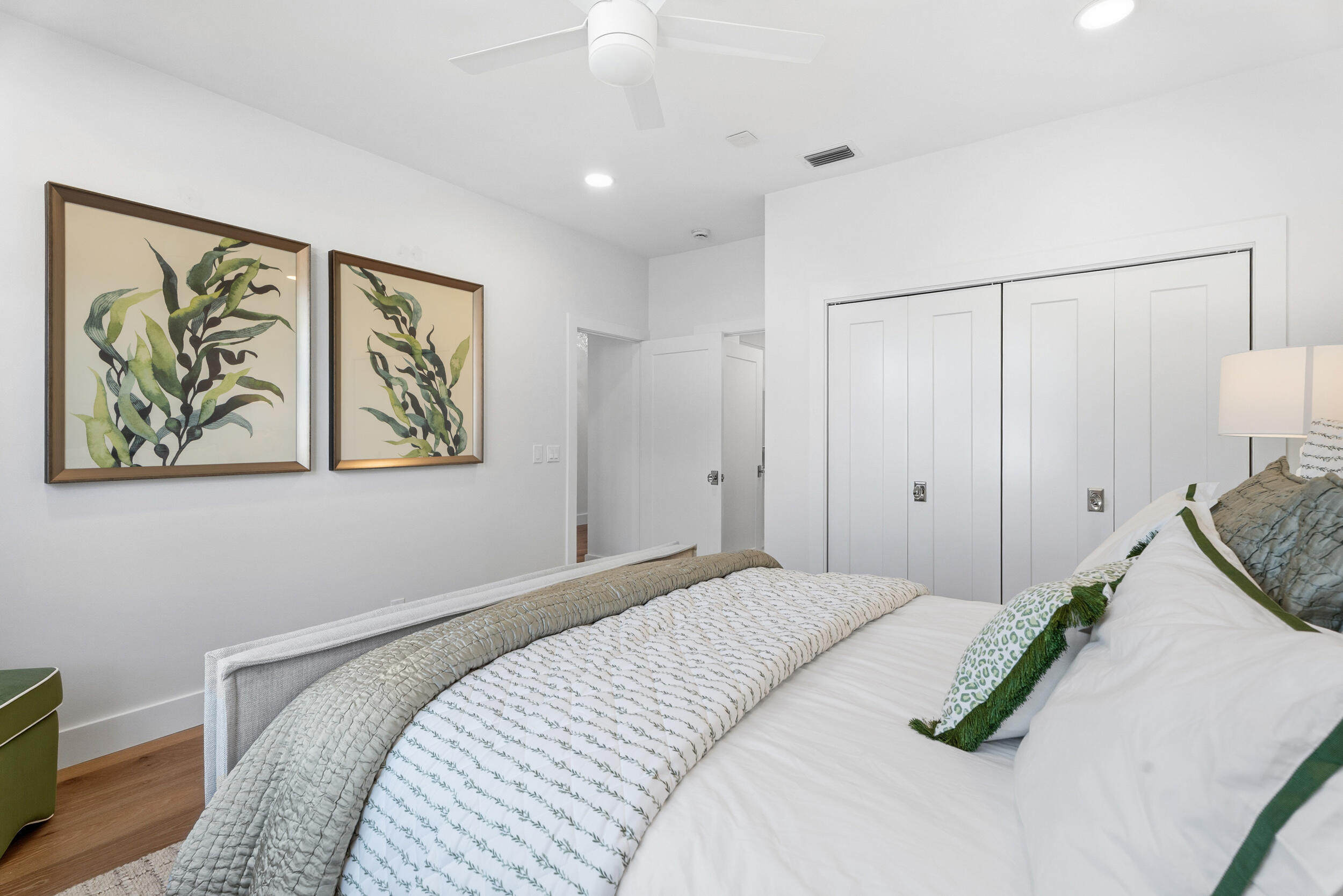 3660 Northwind Court Jupiter, FL 33477 - Photo 29 of 69 a bedroom with a bed and a painting on the wall