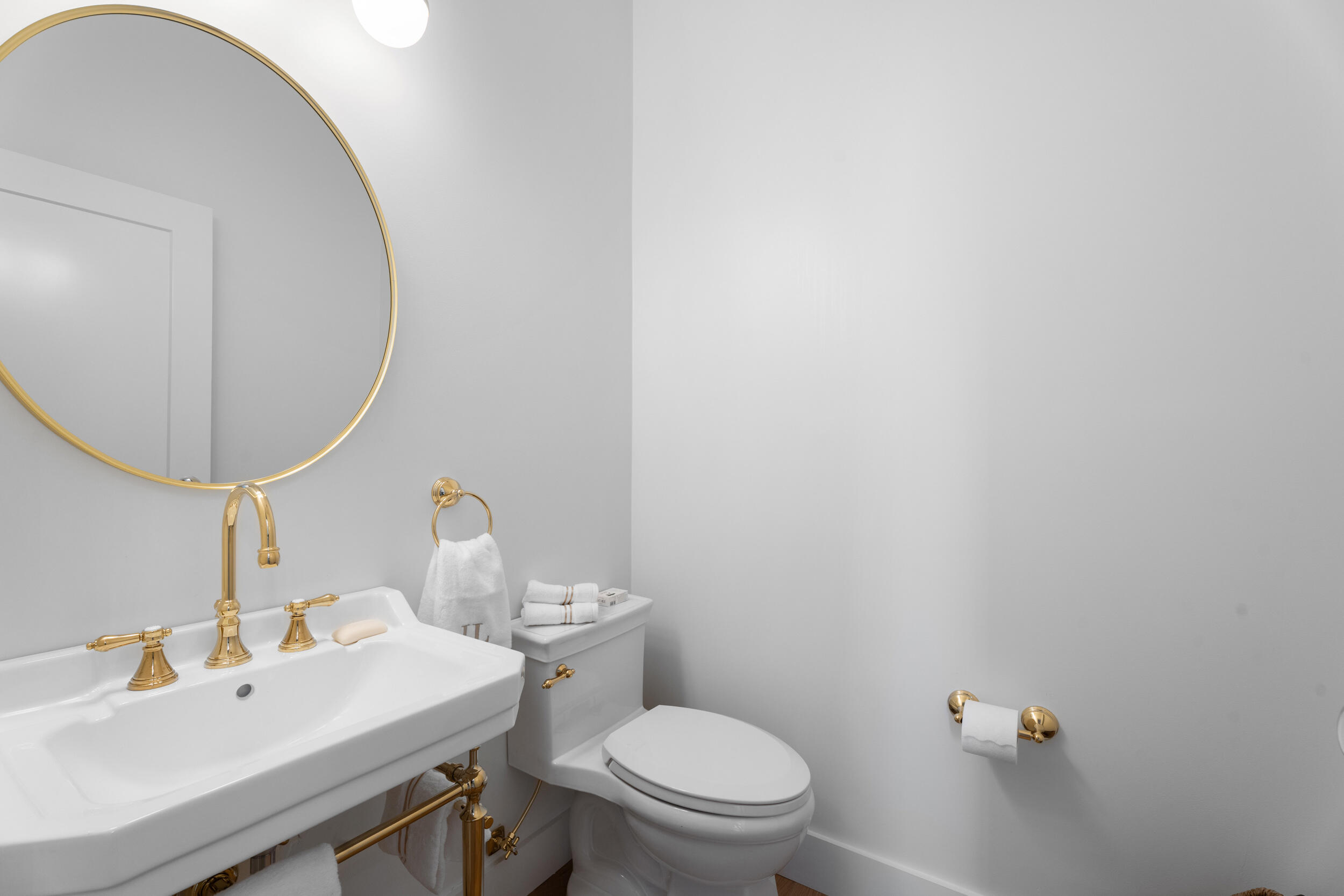3660 Northwind Court Jupiter, FL 33477 - Photo 32 of 69 a bathroom with a sink mirror and toilet
