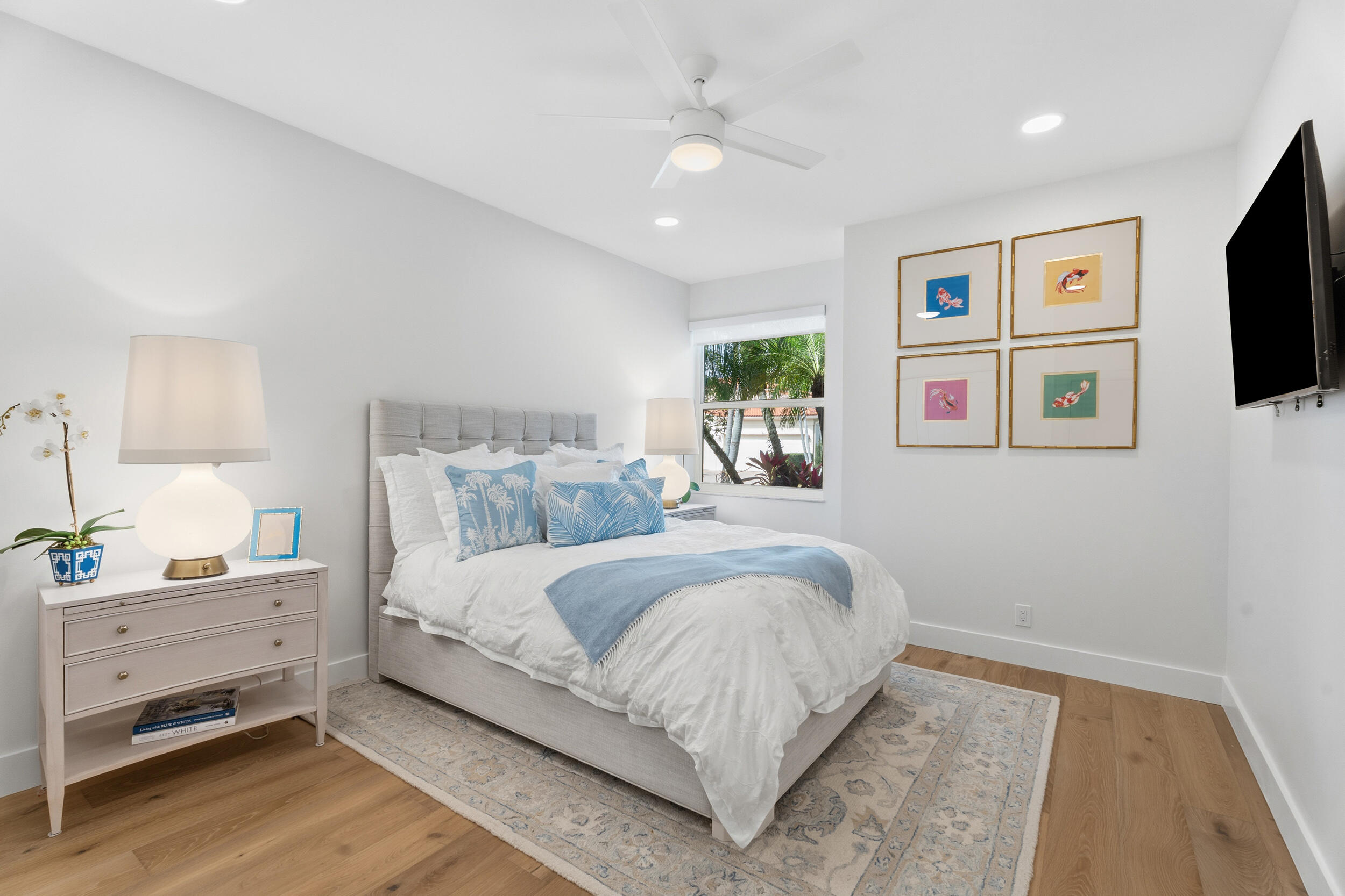 3660 Northwind Court Jupiter, FL 33477 - Photo 33 of 69 a bedroom with a bed and a flat screen tv