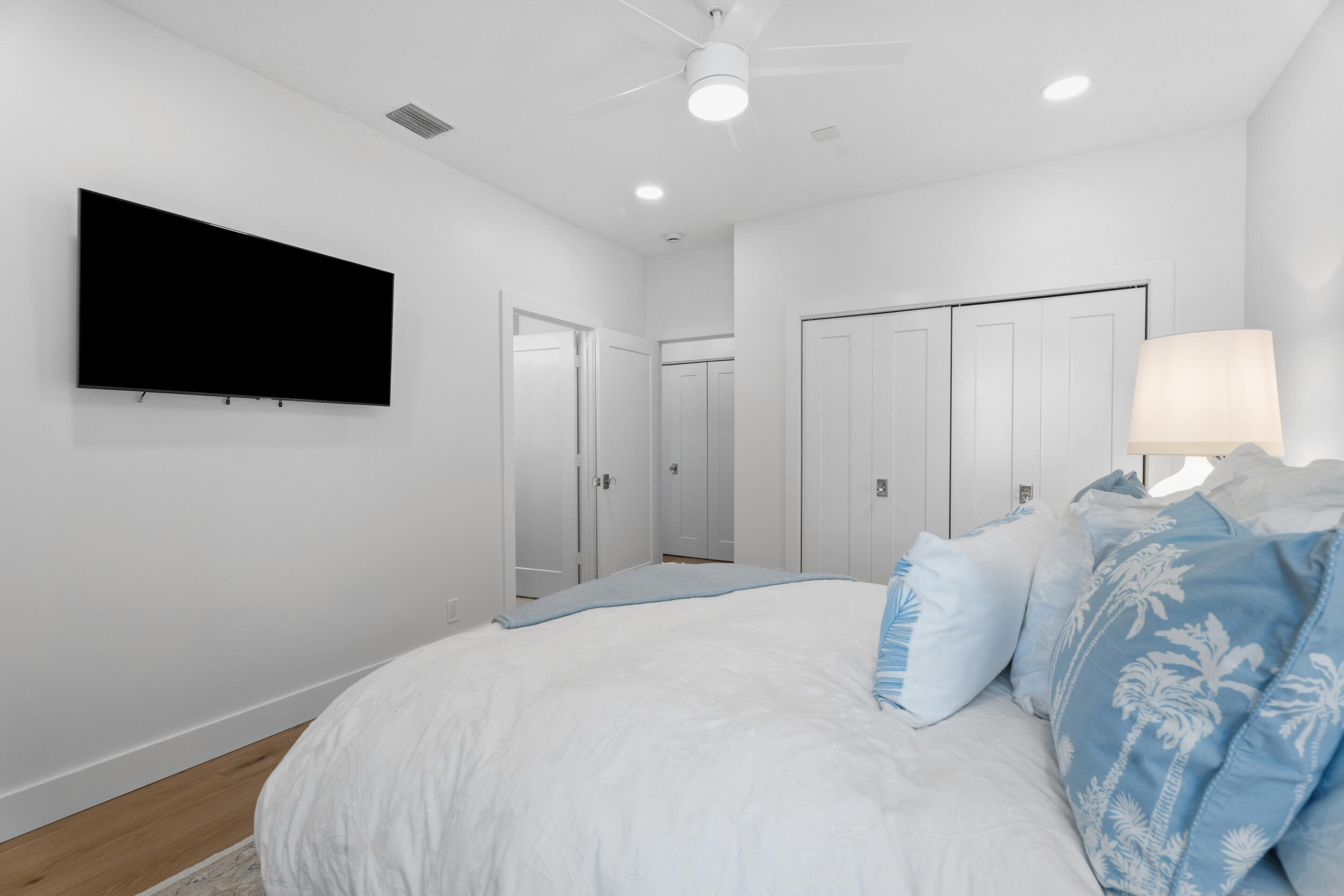 3660 Northwind Court Jupiter, FL 33477 - Photo 34 of 69 a bedroom with a bed and a flat screen tv