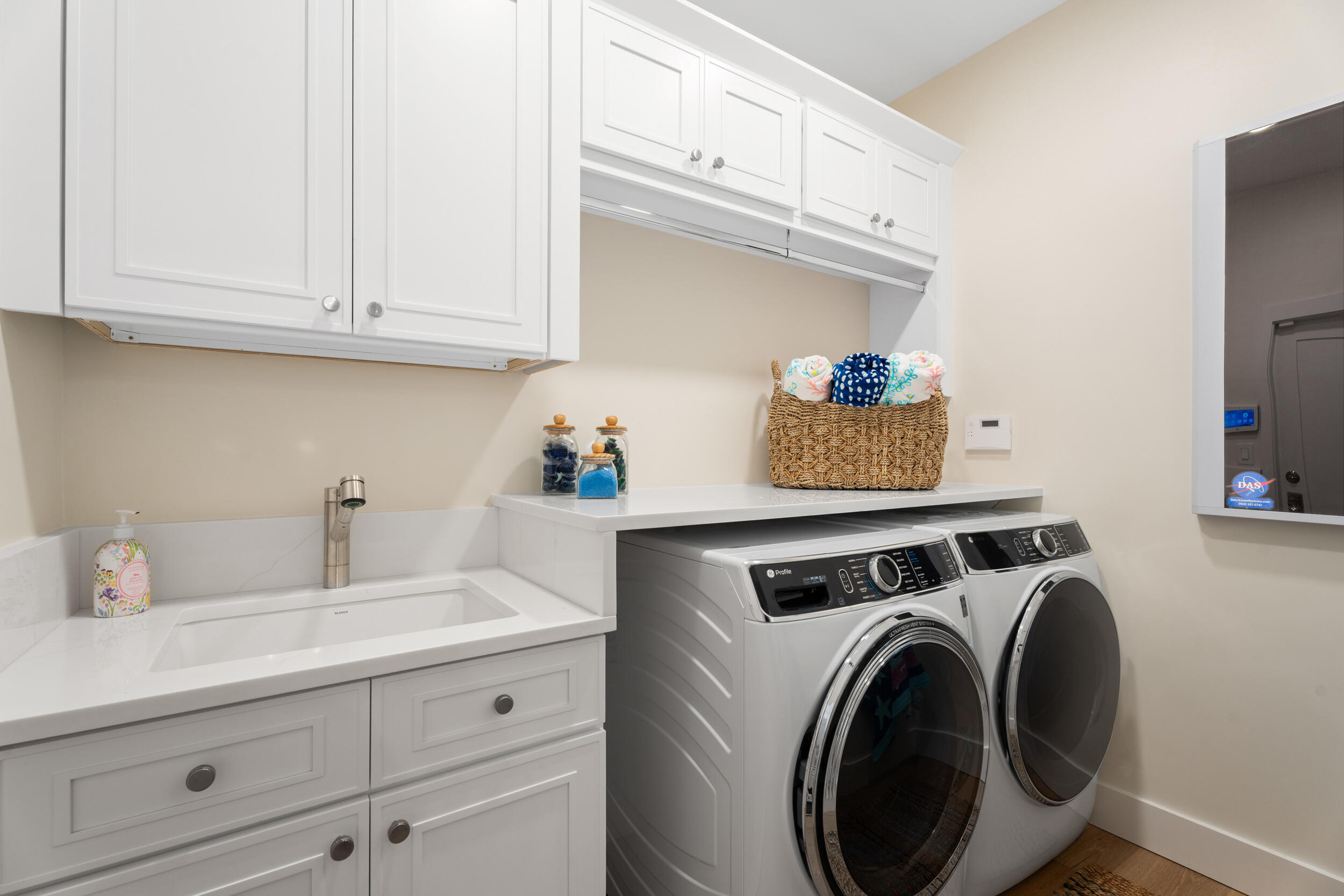 3660 Northwind Court Jupiter, FL 33477 - Photo 36 of 69 a view of cabinets a washer and dryer