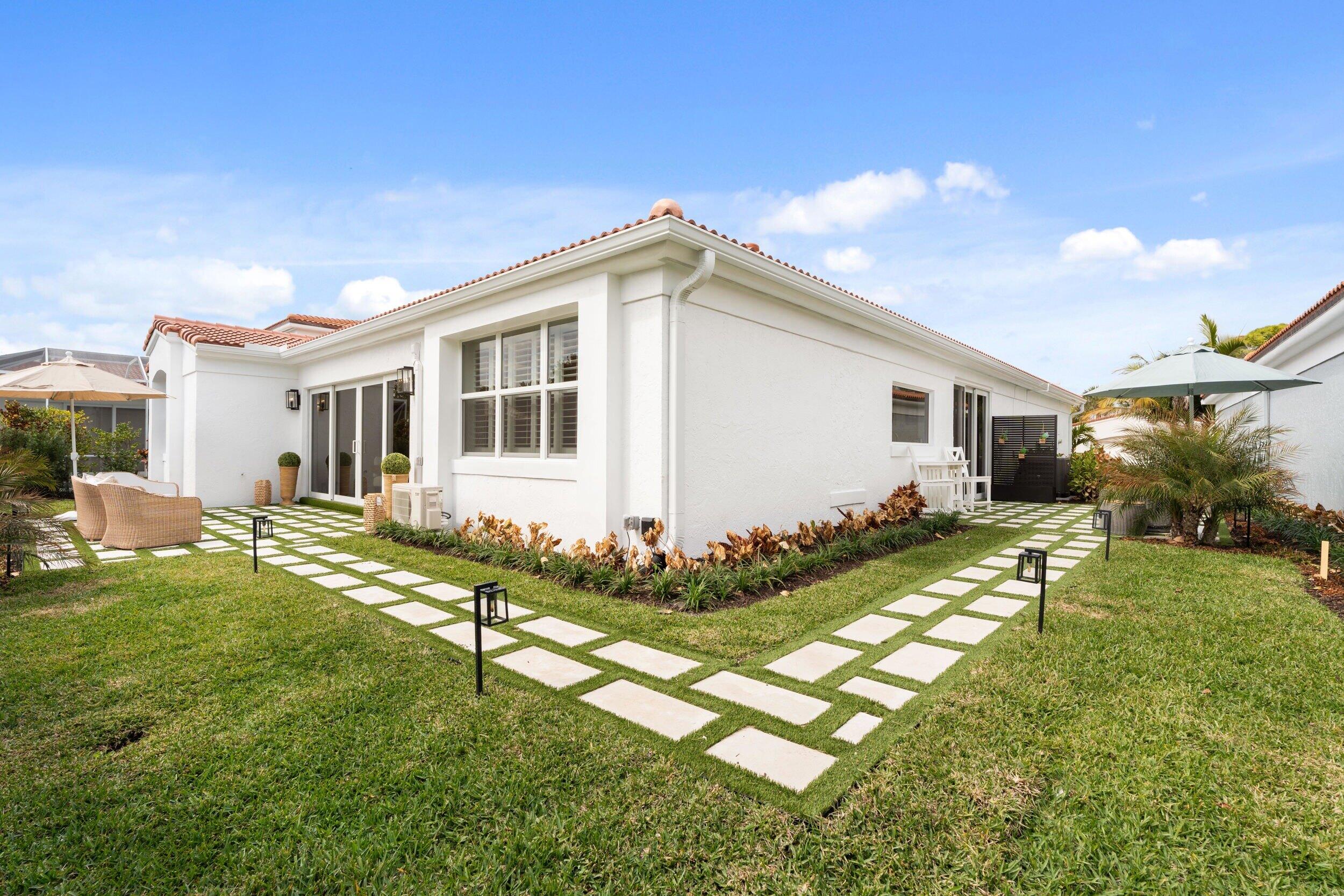 3660 Northwind Court Jupiter, FL 33477 - Photo 37 of 69 a view of a house with backyard and sitting area