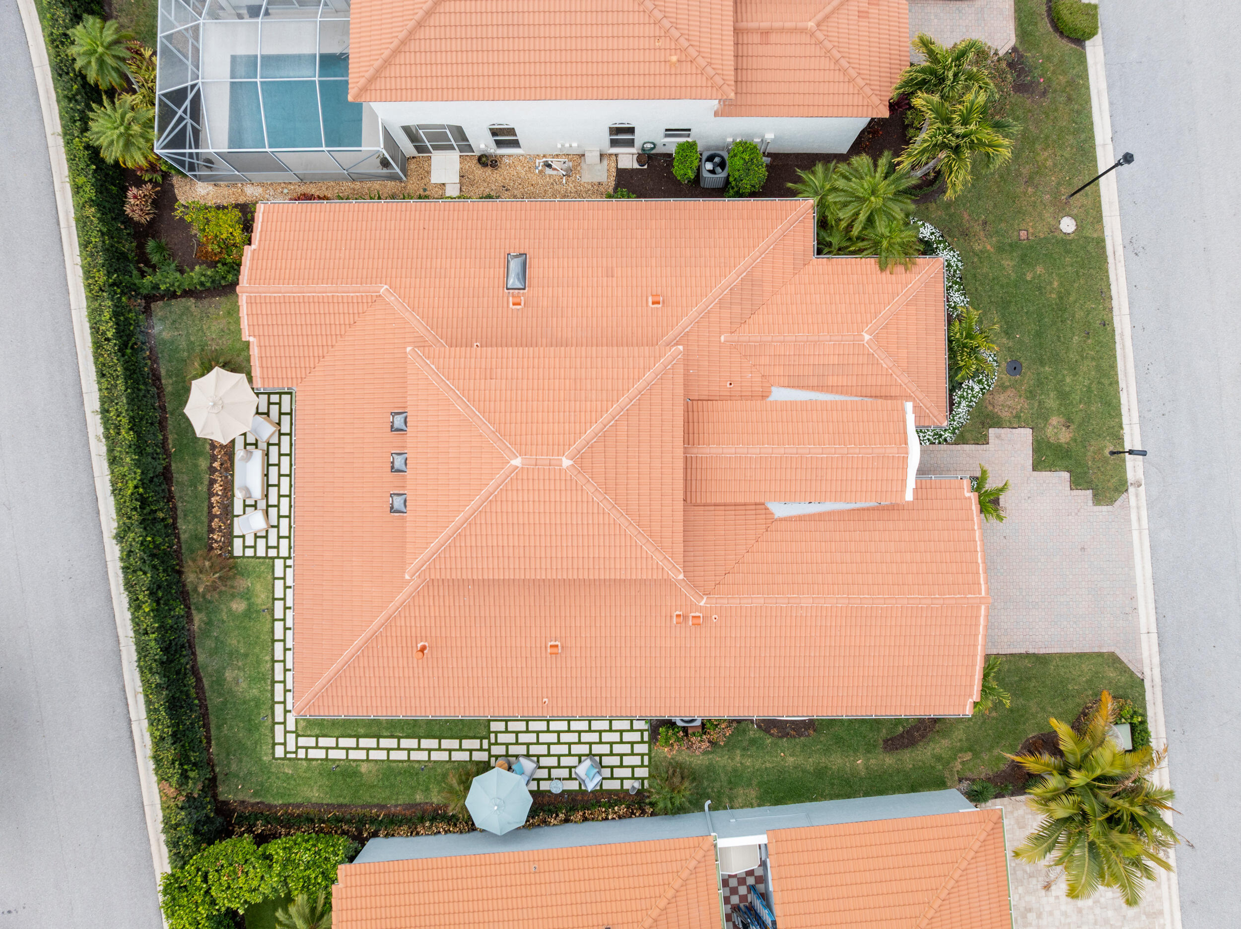 3660 Northwind Court Jupiter, FL 33477 - Photo 45 of 69 an aerial view of a house with a garden and trees