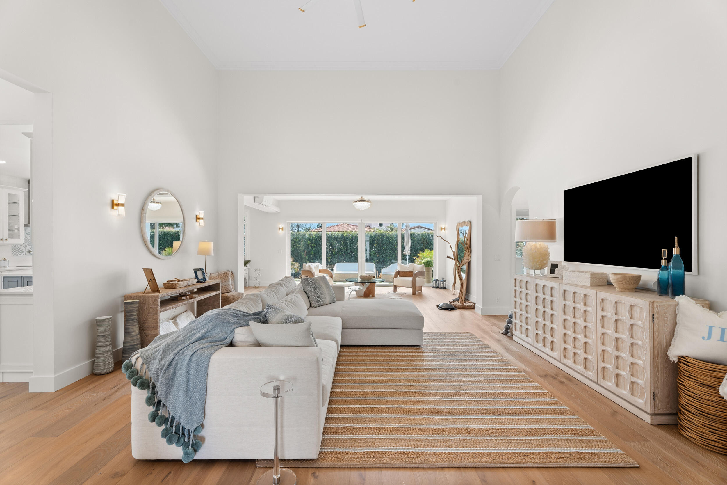 3660 Northwind Court Jupiter, FL 33477 - Photo 6 of 69 a living room with furniture and a flat screen tv