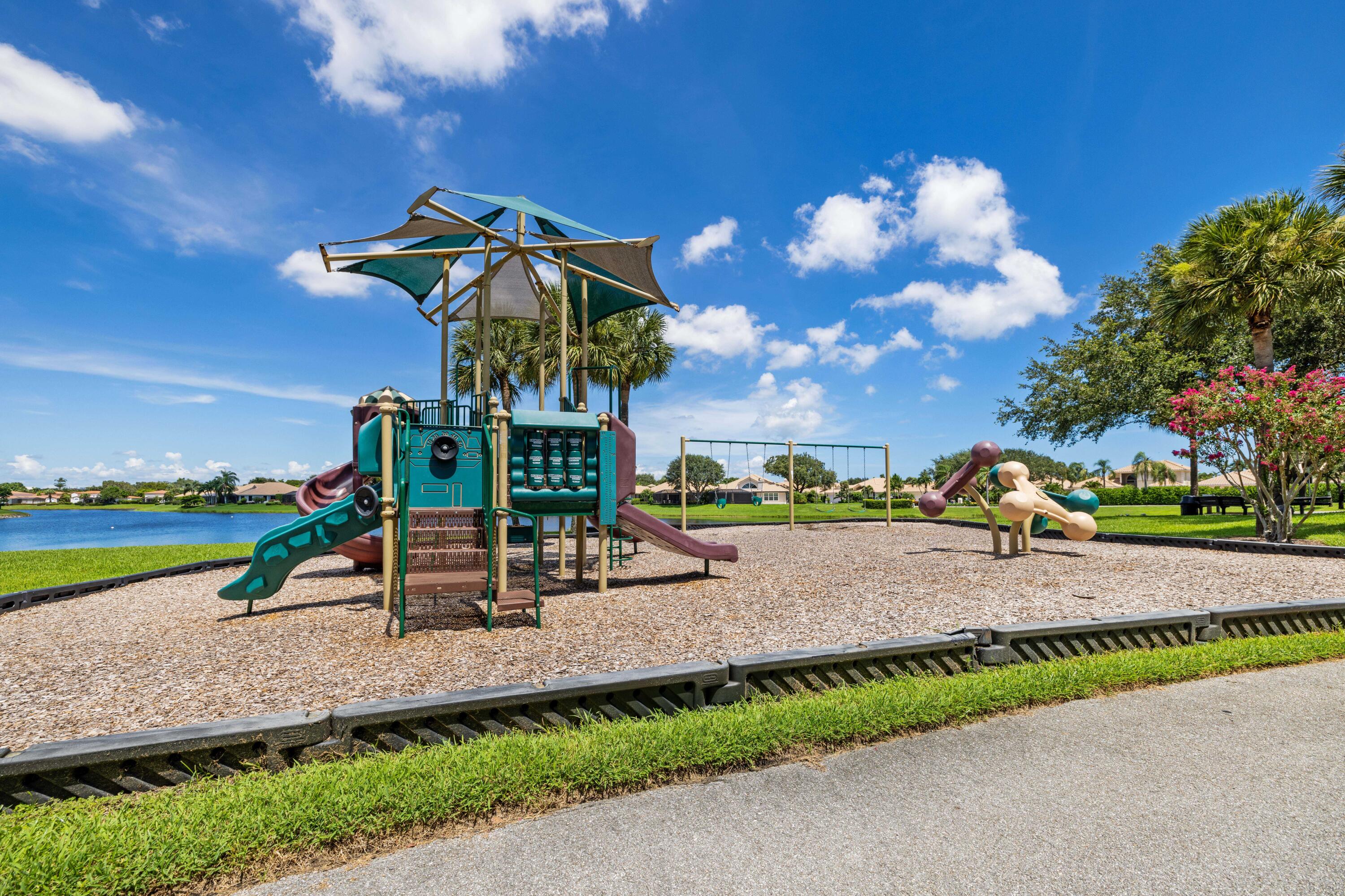 3660 Northwind Court Jupiter, FL 33477 - Photo 64 of 69 a view of a park with swings