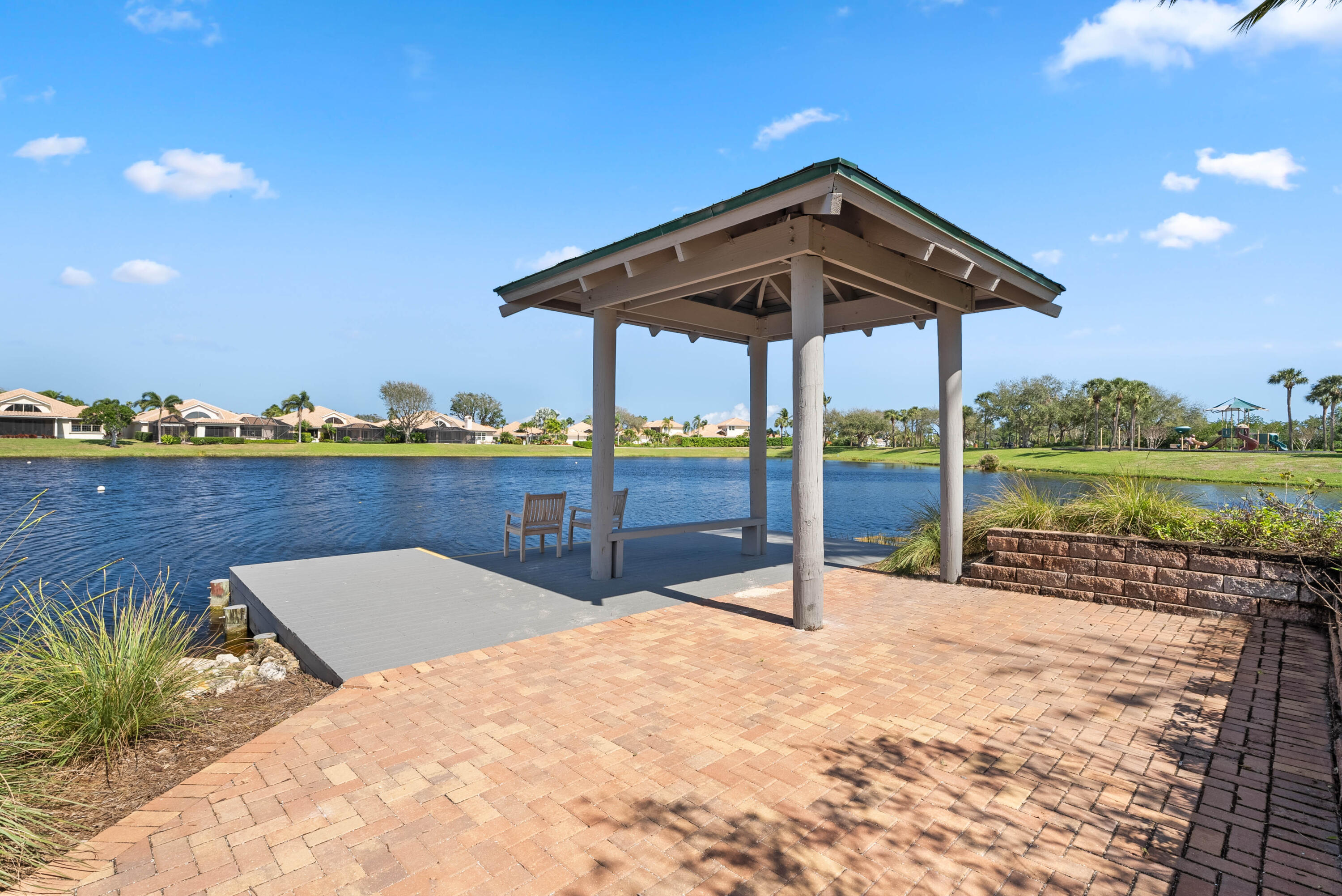 3660 Northwind Court Jupiter, FL 33477 - Photo 68 of 69 a view of a roof deck with couches and wooden floor