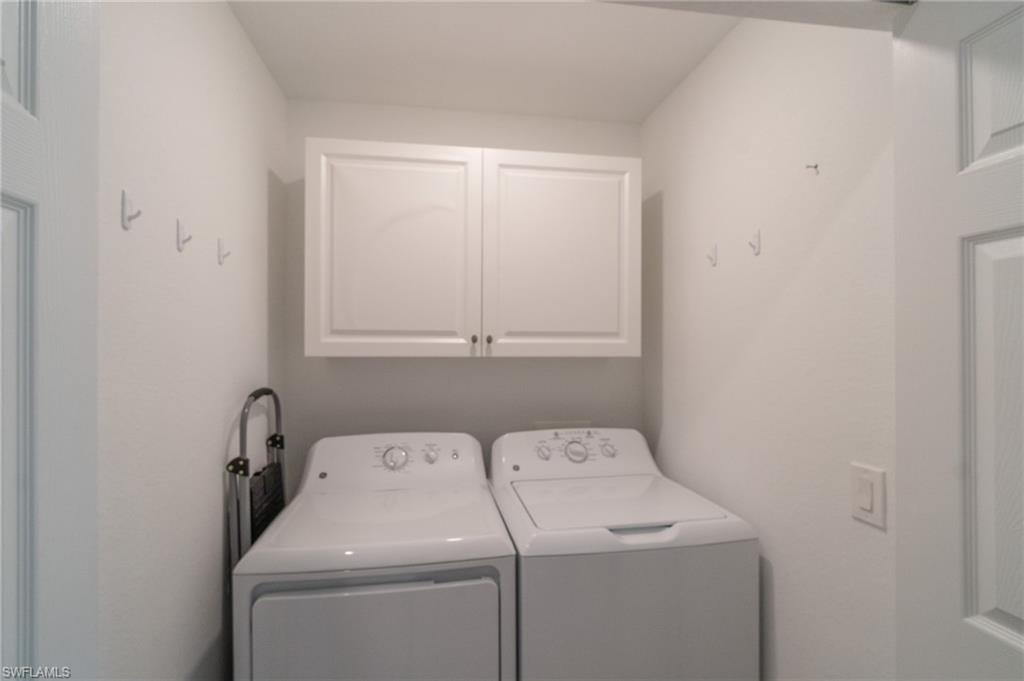 9596 Trevi Court, Unit 5426 Naples, FL 34113 - Photo 19 of 21 a utility room with dryer and washer