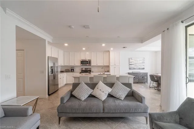 a living room with furniture white walls and white walls