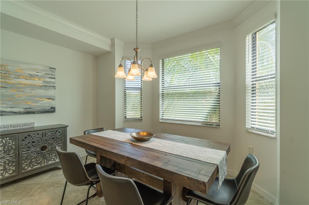 9596 Trevi Court, Unit 5426 Naples, FL 34113 - Photo 10 of 21 a view of a dining room with furniture window and outside view