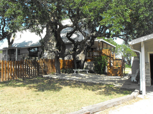 1410 Clear Spring Drive Kerrville, TX 78028 - Photo 1 of 1 a view of street with large trees