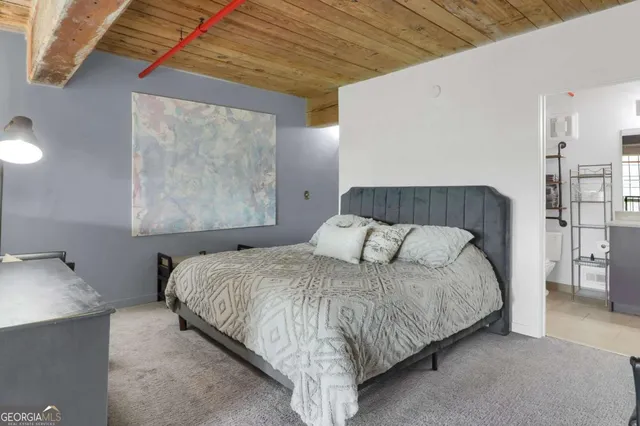 a bedroom with a bed and night stand