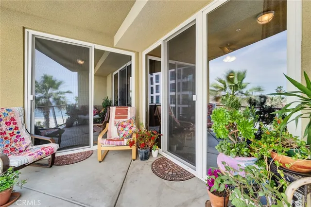 a living room with furniture and a book shelf