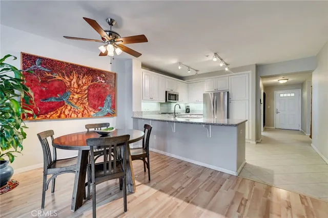 a view of a dining room with furniture and wooden floor