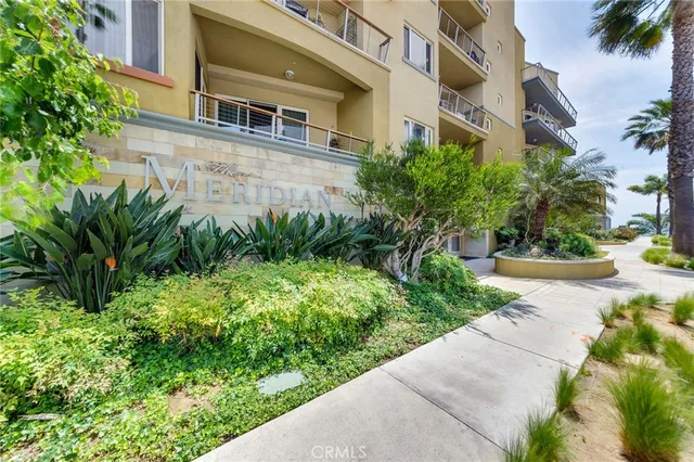 a flower garden is sitting in front of a building
