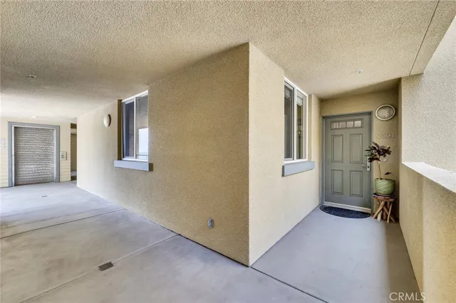 a living room with furniture and a book shelf