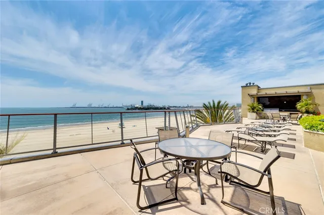 a view of a patio with couches chairs and potted plants