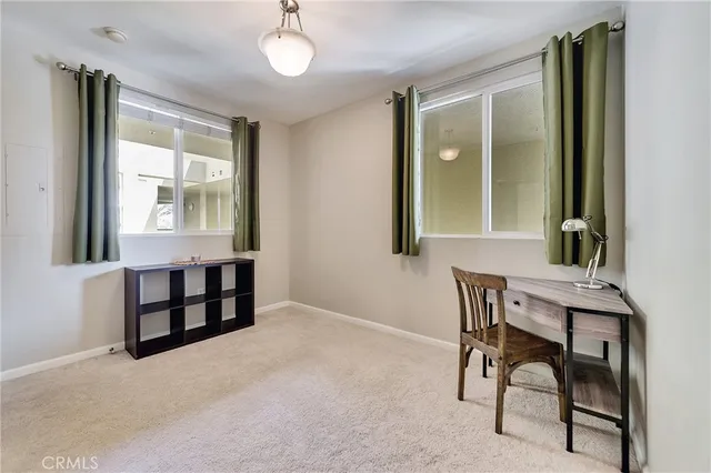 a view of a livingroom with furniture and window