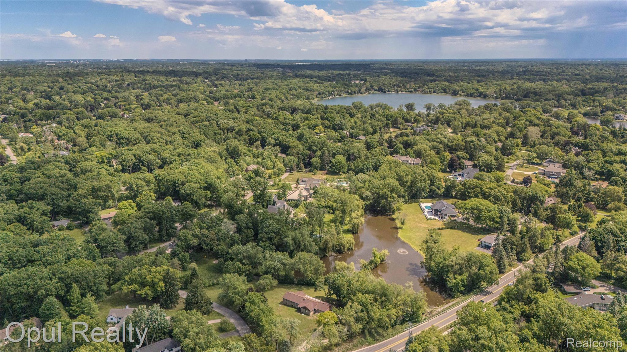 6455 Norham Road Bloomfield Hills, MI 48301 - Photo 74 of 93 Expansive wooded landscape featuring multiple bodies of water and residential properties