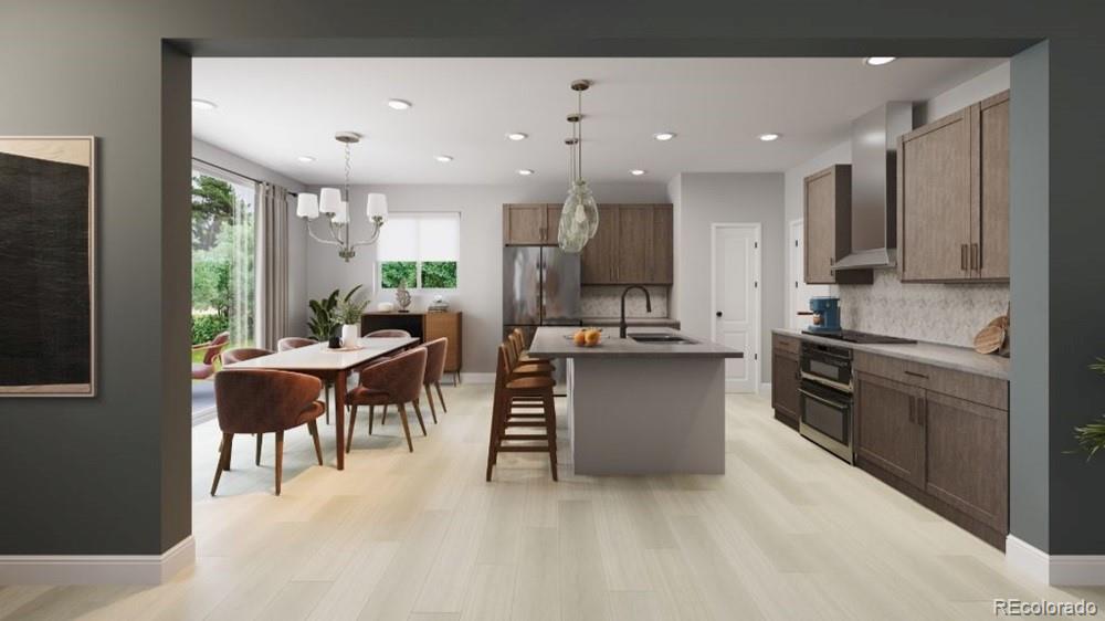 9173 Violet Way Arvada, CO 80007 - Photo 5 of 32 a living room with stainless steel appliances kitchen island granite countertop furniture and a kitchen view