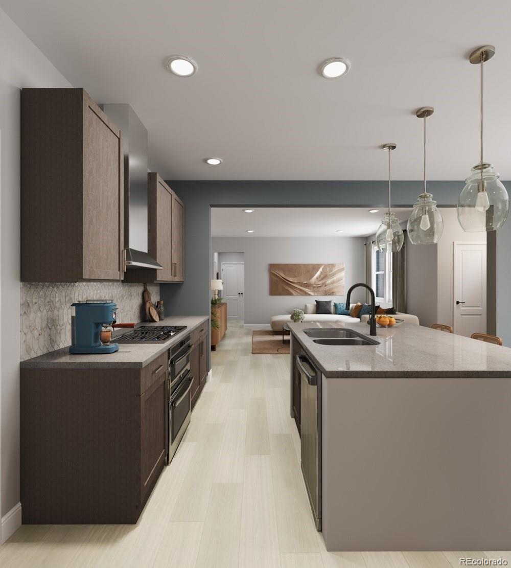 9173 Violet Way Arvada, CO 80007 - Photo 10 of 32 a kitchen with stainless steel appliances granite countertop a sink a stove and a refrigerator