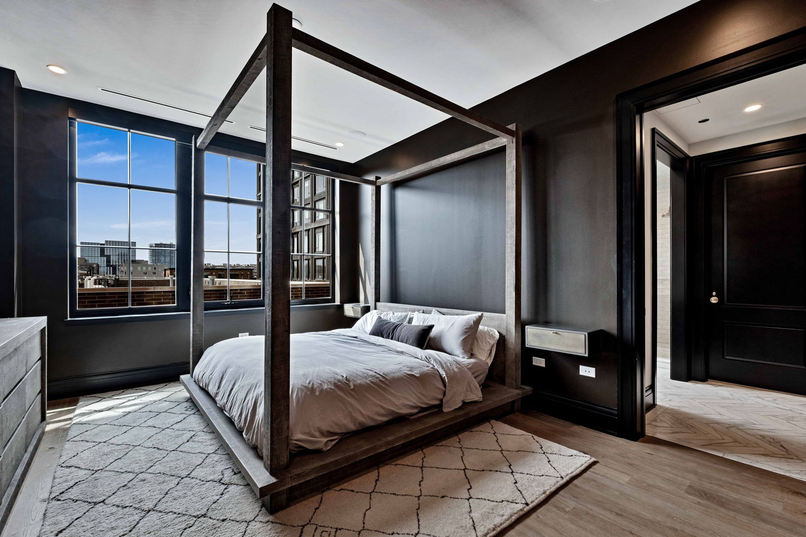 1109 West Washington Boulevard, Unit 5C Chicago, IL 60607 - Photo 25 of 31 a bedroom with a bed and a mirror