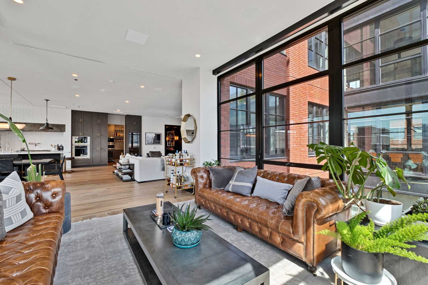 1109 West Washington Boulevard, Unit 5C Chicago, IL 60607 - Photo 9 of 31 a living room with furniture fireplace and a large window