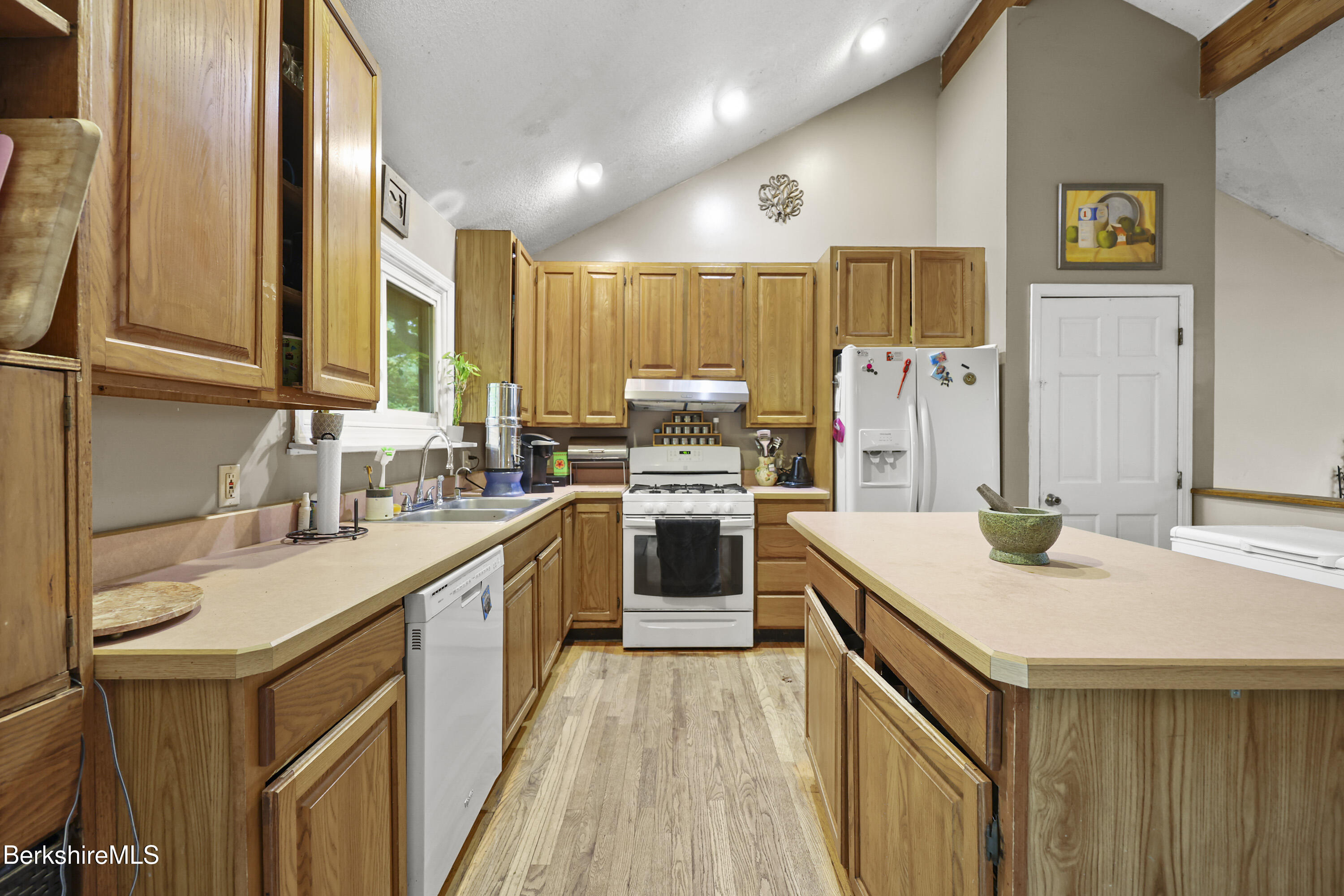 1592 County Road Sheffield, MA 01230 - Photo 13 of 32 a kitchen with a sink stove and cabinets
