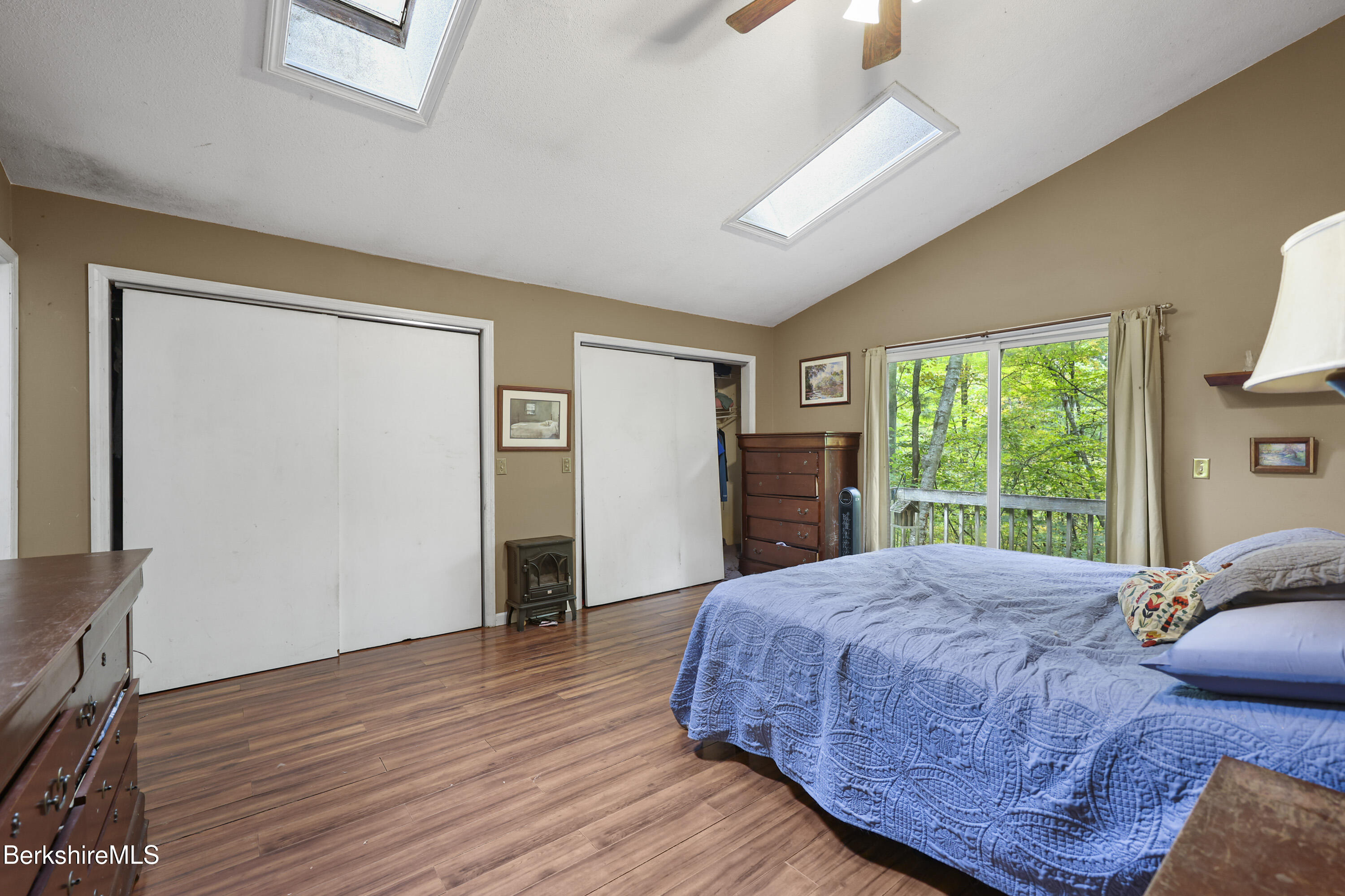1592 County Road Sheffield, MA 01230 - Photo 15 of 32 a bed sitting in a spacious bedroom next to a window