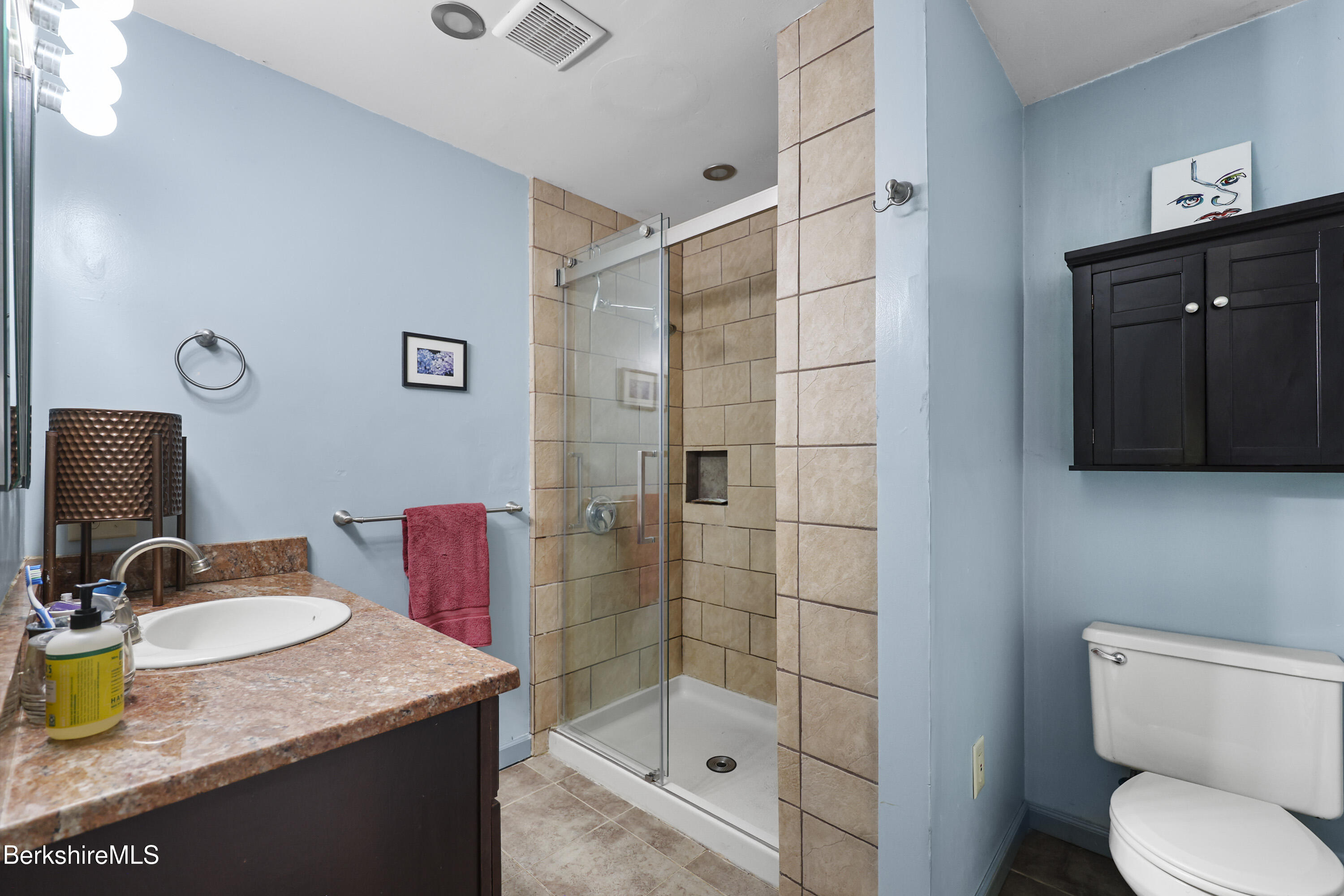 1592 County Road Sheffield, MA 01230 - Photo 17 of 32 a bathroom with a granite countertop sink toilet and shower