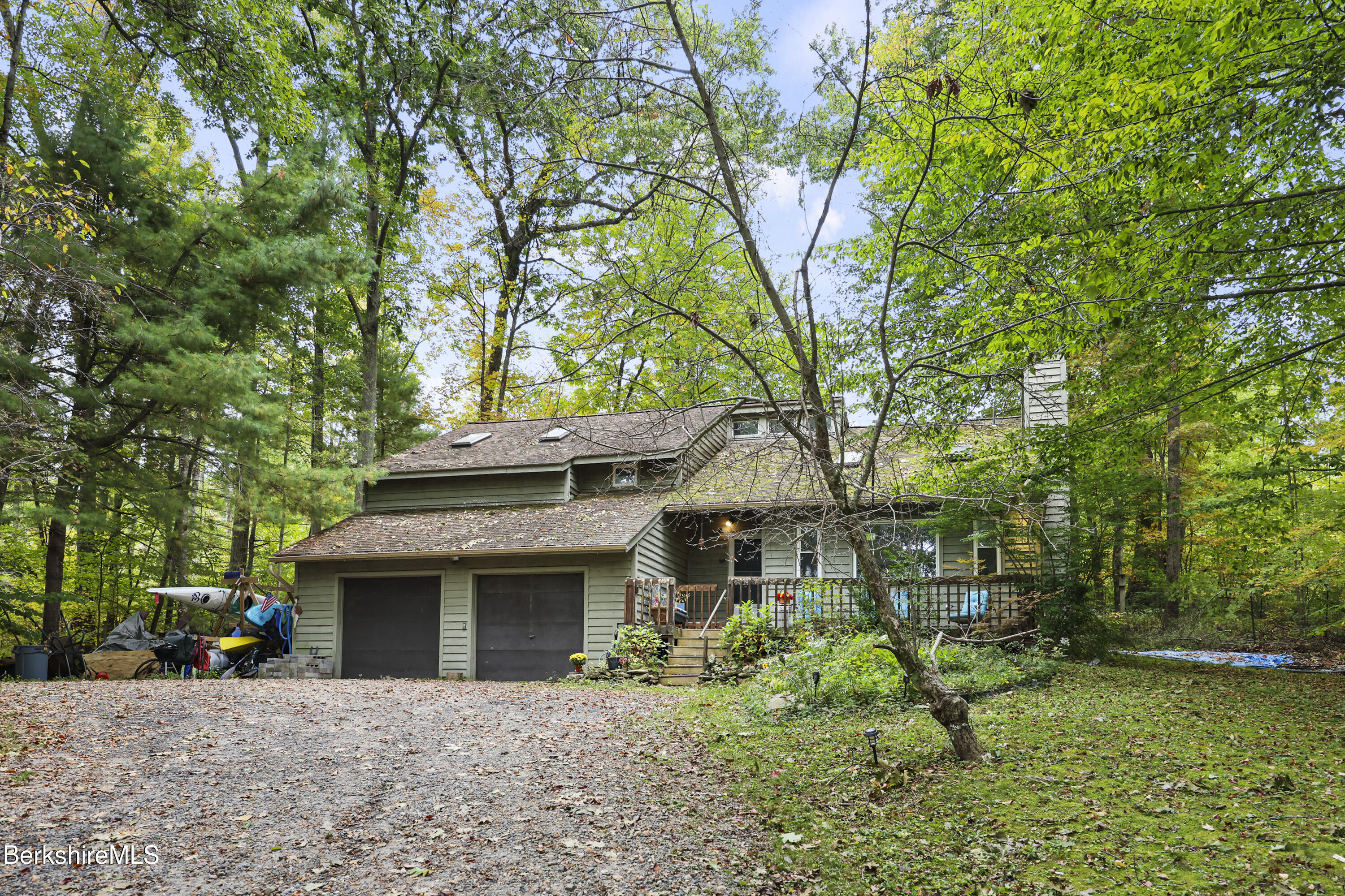 1592 County Road Sheffield, MA 01230 - Photo 2 of 32 a front view of a house with a yard