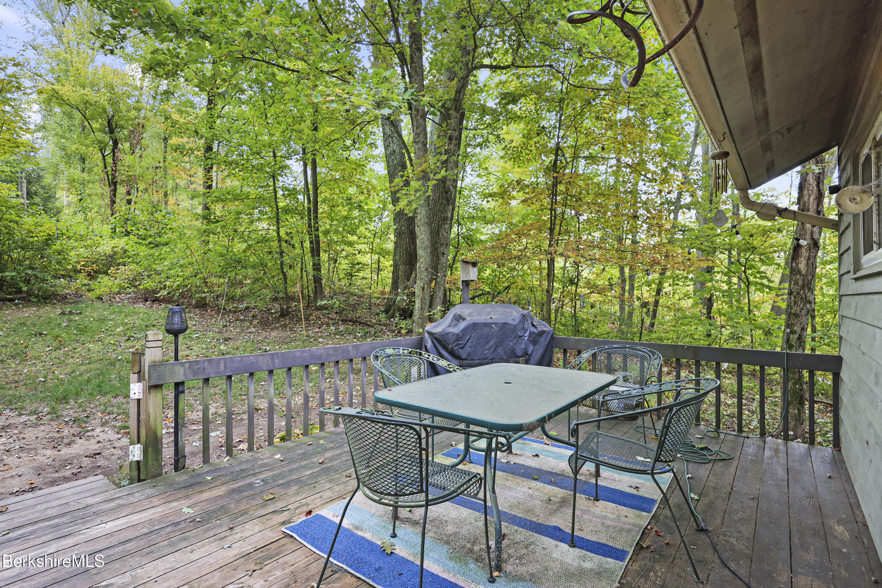 1592 County Road Sheffield, MA 01230 - Photo 28 of 32 a view of a table and chairs in patio