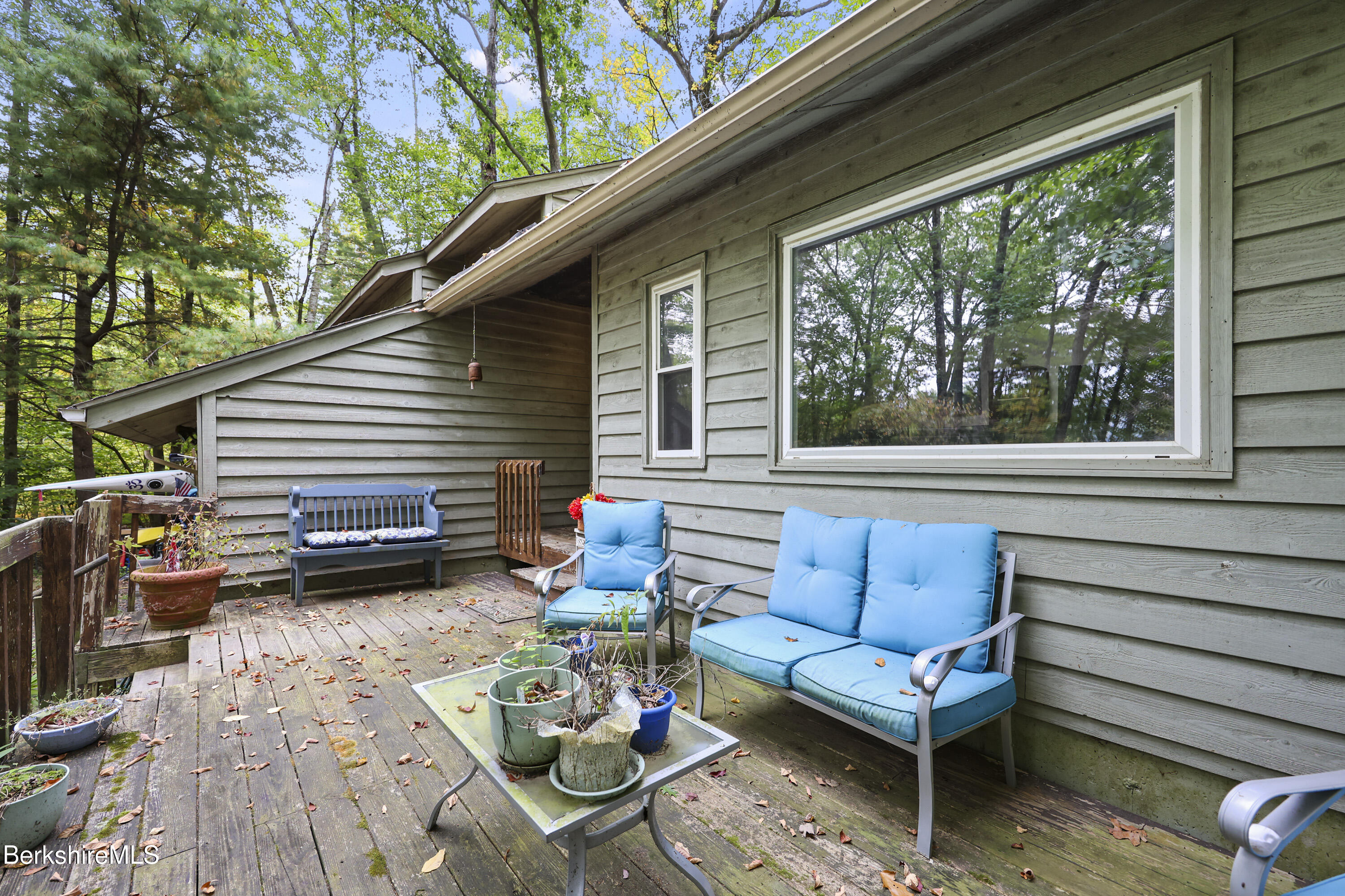 1592 County Road Sheffield, MA 01230 - Photo 4 of 32 a view of a patio with couches table and chairs and potted plants