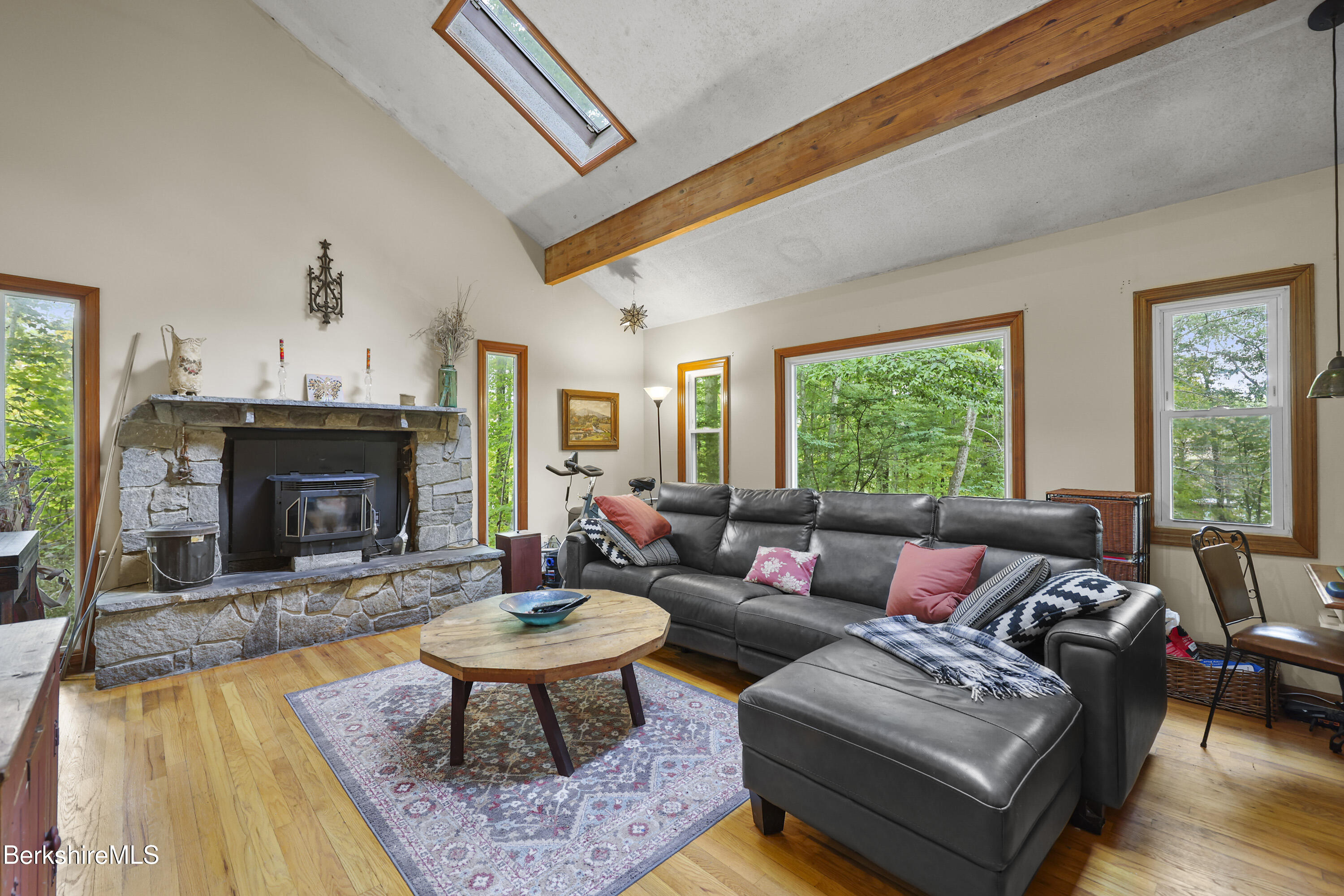 1592 County Road Sheffield, MA 01230 - Photo 7 of 32 a living room with furniture a fireplace and a large window