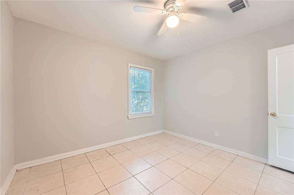 2275 Old Spring Road Smyrna, GA 30080 - Photo 19 of 28 an empty room with a chandelier fan